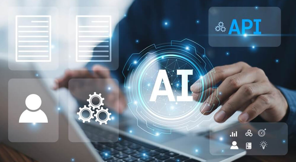 Effortless Operations: A digital composite image showcases modern technology in actuarial operations. The central focus is a translucent blue ‘AI’ symbol, representing artificial intelligence, surrounded by icons and graphics symbolizing data processing and technological interfaces. In the foreground, hands interact with a tablet, reflecting an advanced AI-driven system for efficient actuarial valuation.