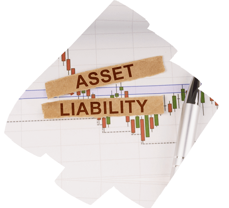 A financial chart with green and red bars, indicative of market data, overlaid with two pieces of tape crossing each other. On the tape, the words “ASSET” and “LIABILITY” are written in capital letters. A pen lies diagonally across the chart, suggesting analysis or work on asset/liability management.