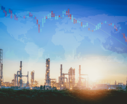 The image features an industrial landscape at dusk with silhouettes of refinery structures, including towers and piping against a twilight sky. Overlaid on the image is a semi-transparent world map with digital graphs and stock market trends indicating global business activity. The visual suggests a connection between industrial manufacturing and global financial markets, highlighting the importance of risk mitigation and compliance in these sectors.