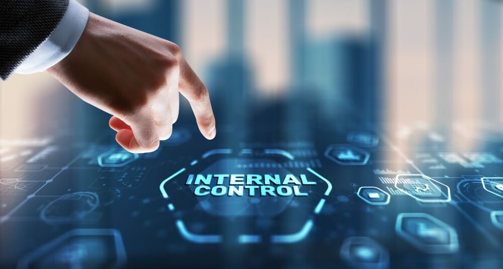 A hand points to a digital interface displaying "INTERNAL CONTROL," highlighting SOX 404 compliance solutions.