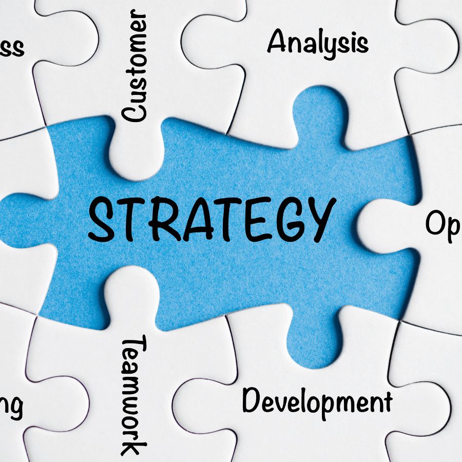 A puzzle with the word "Strategy" in the center, surrounded by terms like "Analysis," "Development," and "Teamwork," symbolizing a structured approach to business growth. Business Strategy Review ensures data-driven insights for sustainable success.