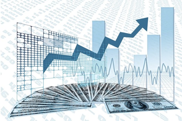 Financial chart with upward trend and dollar bills illustrating the impact of IFRS 2 on business performance