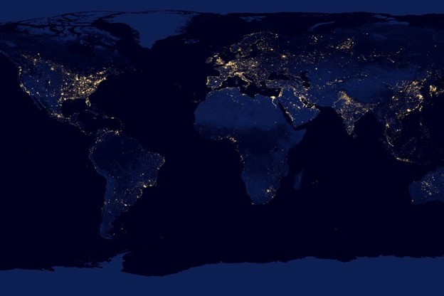 A global night map highlighting city lights, symbolizing the worldwide scope of actuarial valuation across different regions.