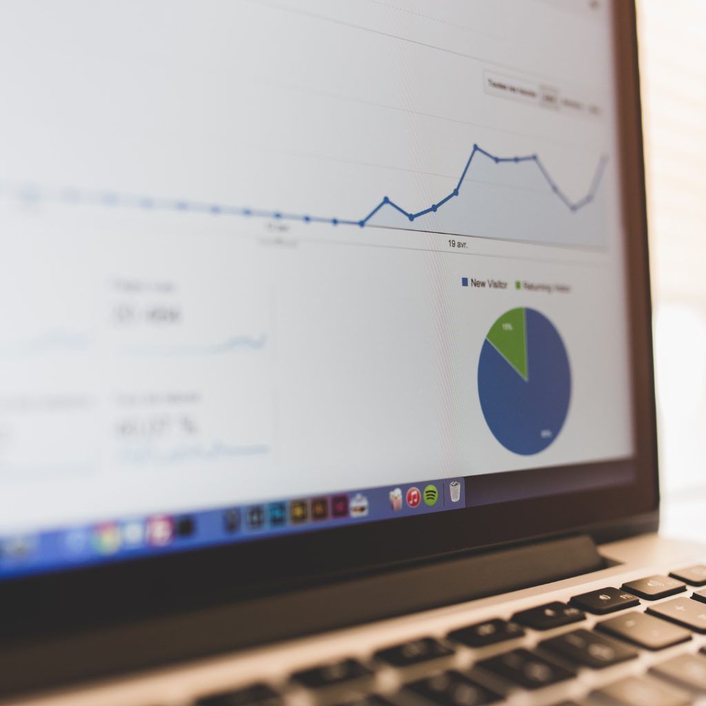 A close-up of a laptop screen displaying professional financial dashboards and data analytics provided by outsourced accounting services.