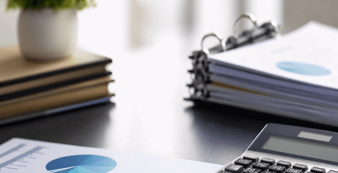 IFRS 2 share-based payment valuation services with financial reports, calculator and accounting documents on a corporate office desk.