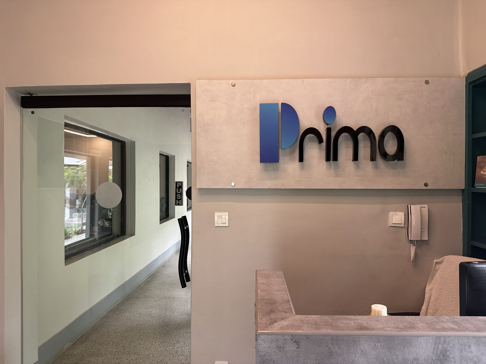 Reception at one of our offices, with the Prima sign on the wall
